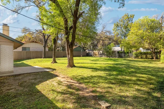 a view of a house with a big yard