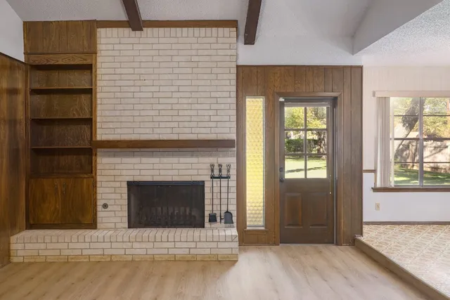 a living room with a fireplace