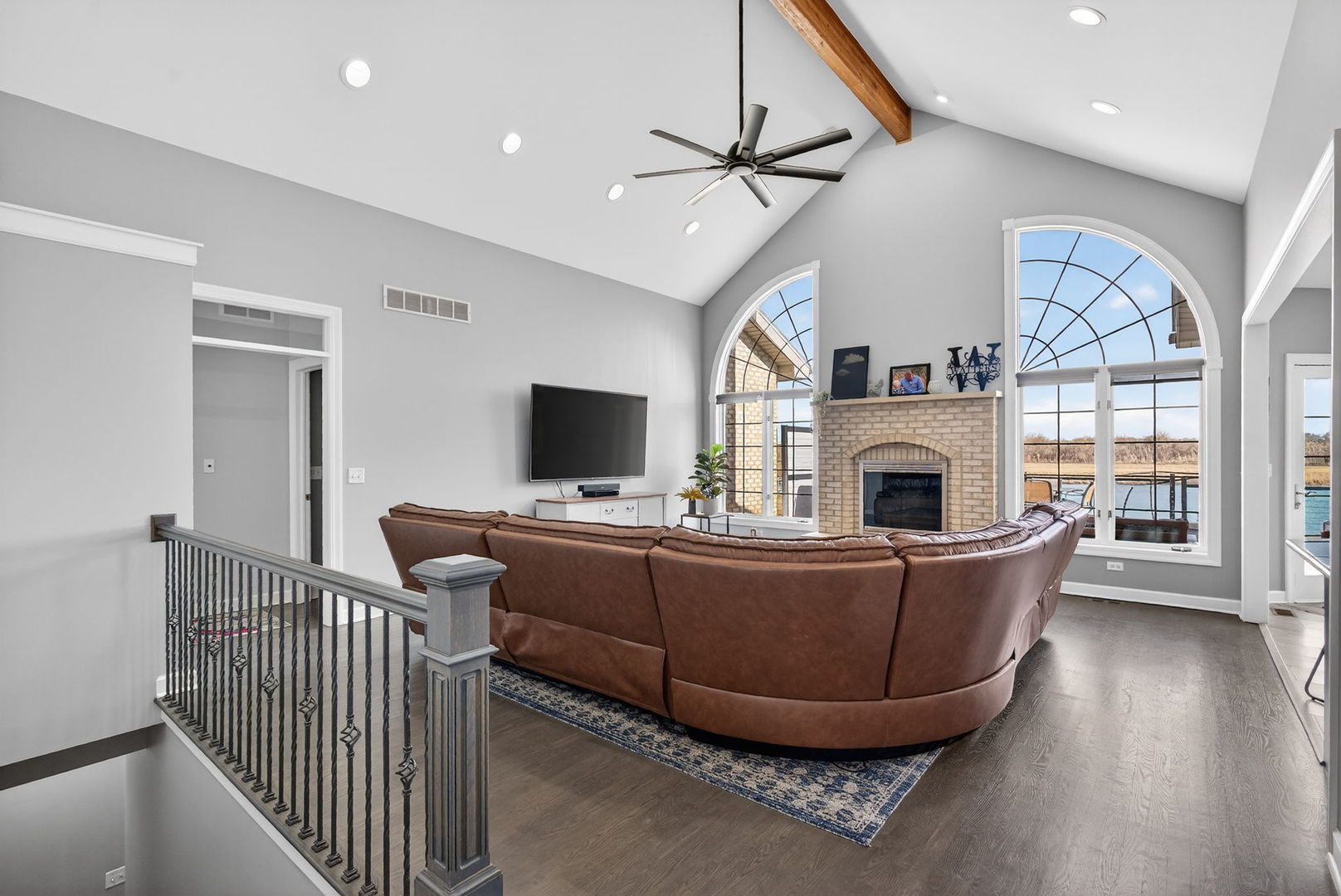 2804 Ninovan Lane Minooka, IL 60447 - Photo 15 of 67 a living room with furniture a fireplace and a flat screen tv