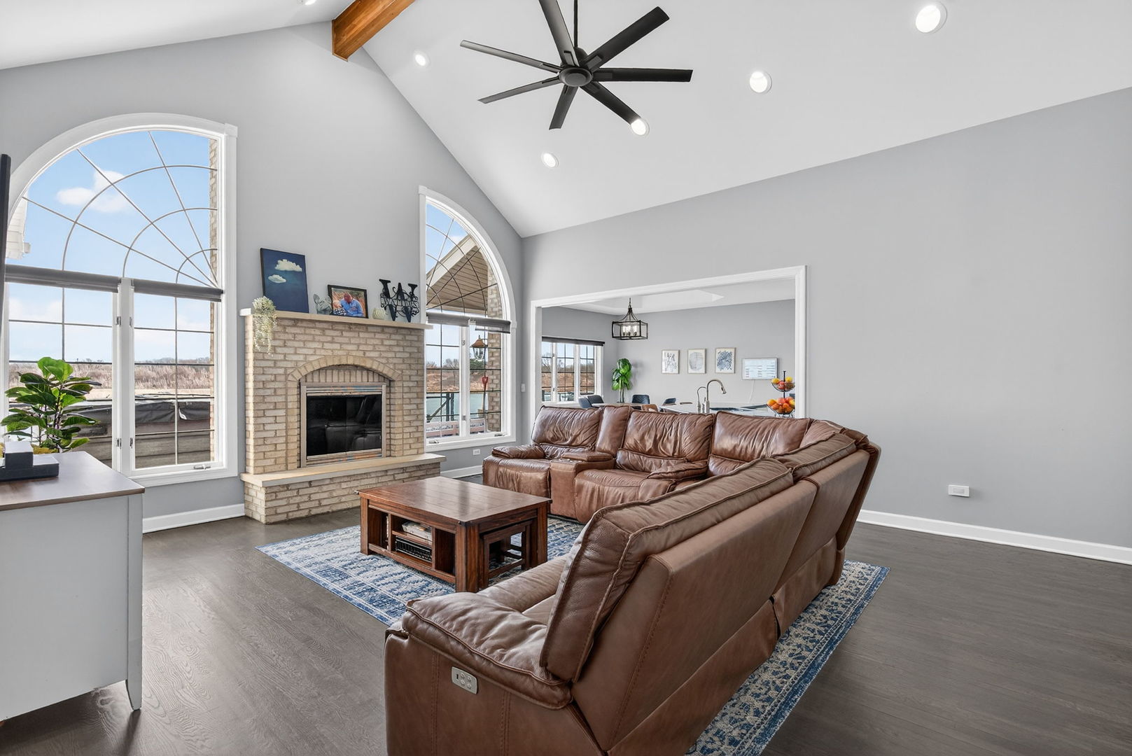 2804 Ninovan Lane Minooka, IL 60447 - Photo 17 of 67 a living room with furniture a fireplace and a potted plant