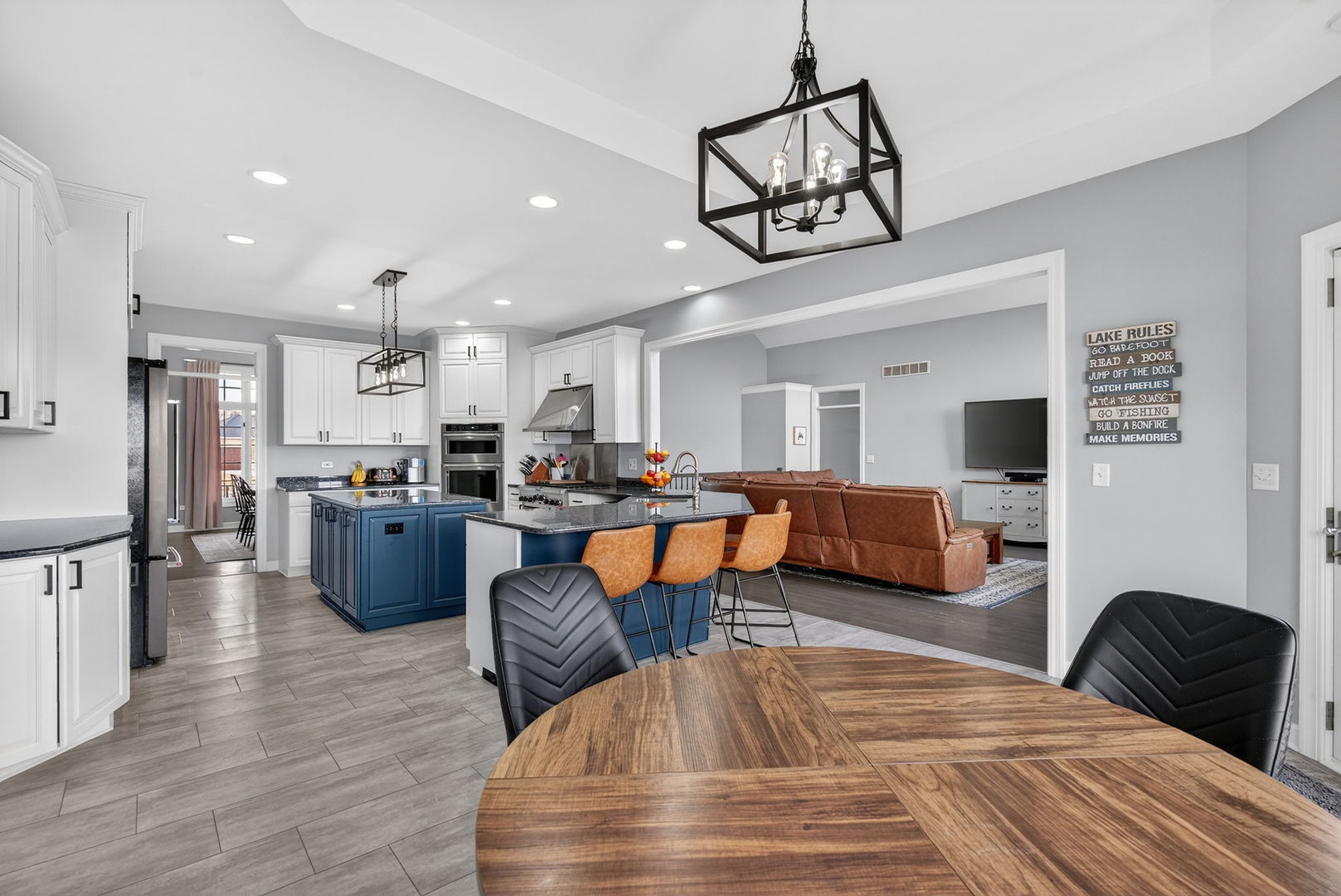 2804 Ninovan Lane Minooka, IL 60447 - Photo 18 of 67 a living room with furniture kitchen view and a fireplace