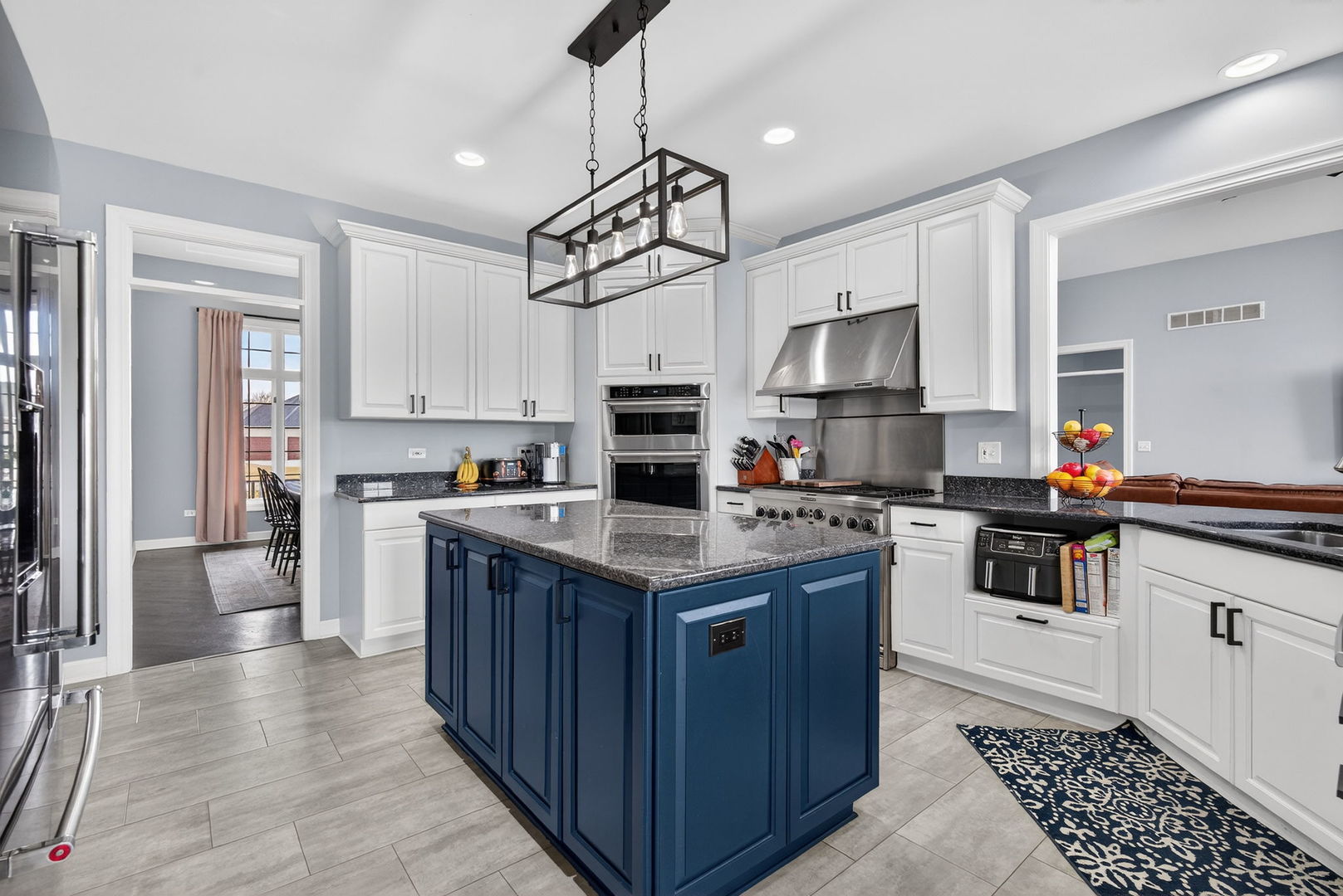 2804 Ninovan Lane Minooka, IL 60447 - Photo 22 of 67 a kitchen with stainless steel appliances granite countertop a stove and a sink