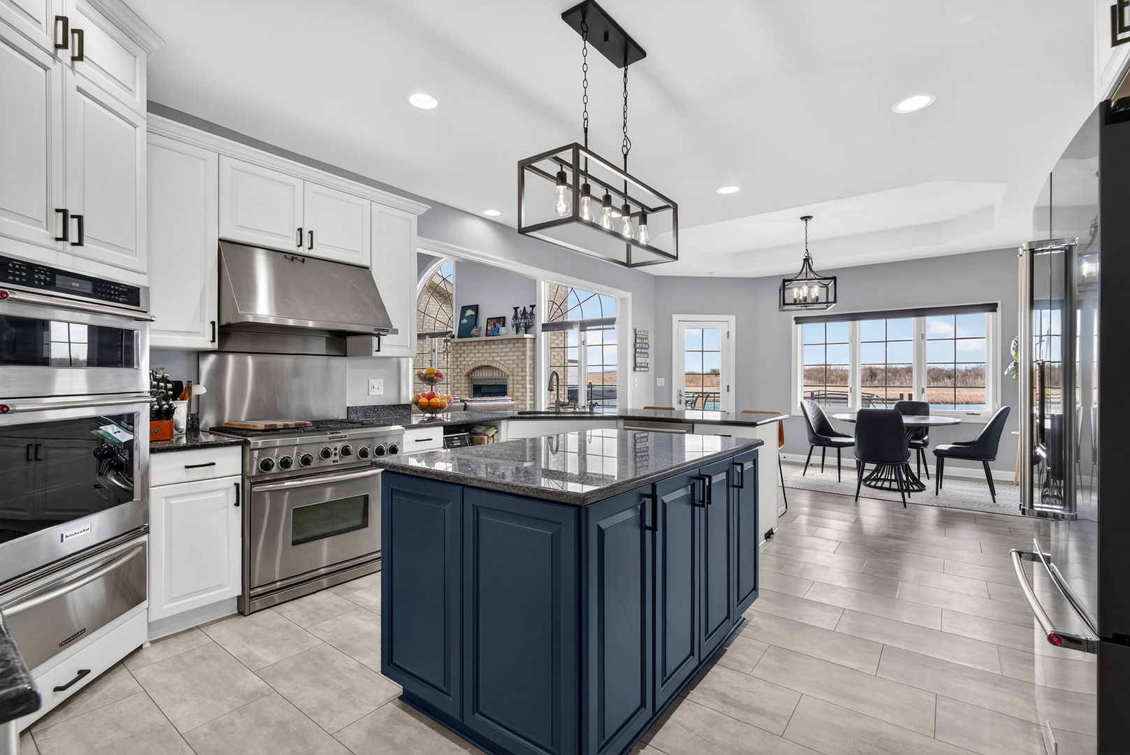 2804 Ninovan Lane Minooka, IL 60447 - Photo 23 of 67 a kitchen with stainless steel appliances granite countertop a stove and a refrigerator