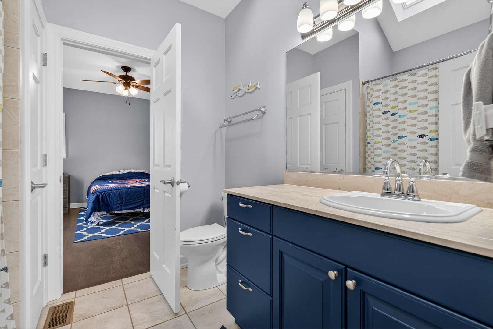 2804 Ninovan Lane Minooka, IL 60447 - Photo 44 of 67 a bathroom with a granite countertop sink a toilet a mirror and shower