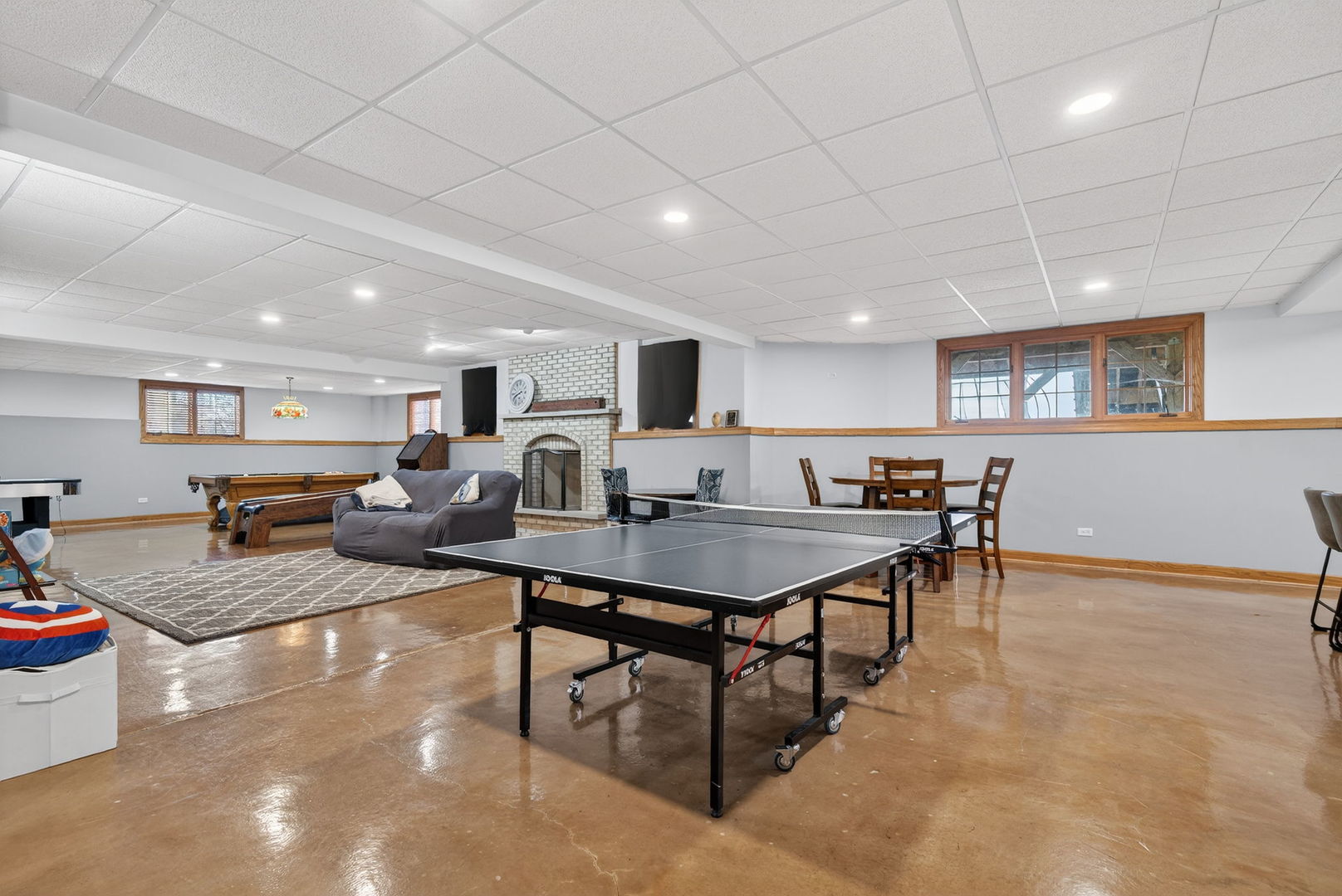 2804 Ninovan Lane Minooka, IL 60447 - Photo 50 of 67 a living room with furniture a table and chairs