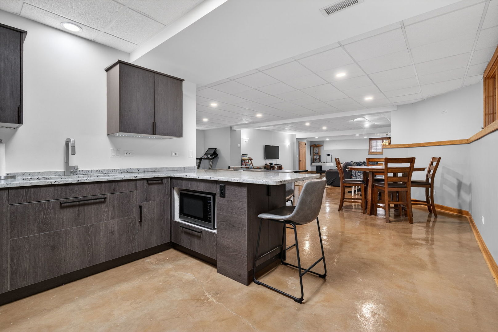 2804 Ninovan Lane Minooka, IL 60447 - Photo 53 of 67 a kitchen with kitchen island granite countertop lots of counter top space and dining table