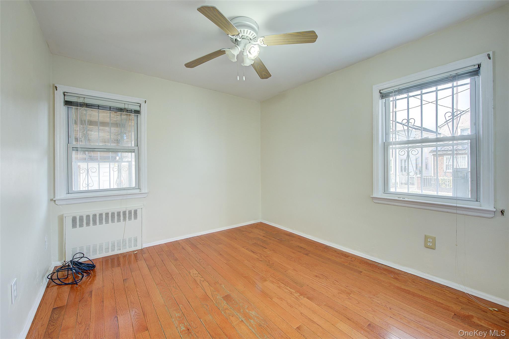 220-04 103rd Avenue Queens, NY 11429 - Photo 13 of 35 a view of an empty room with a window