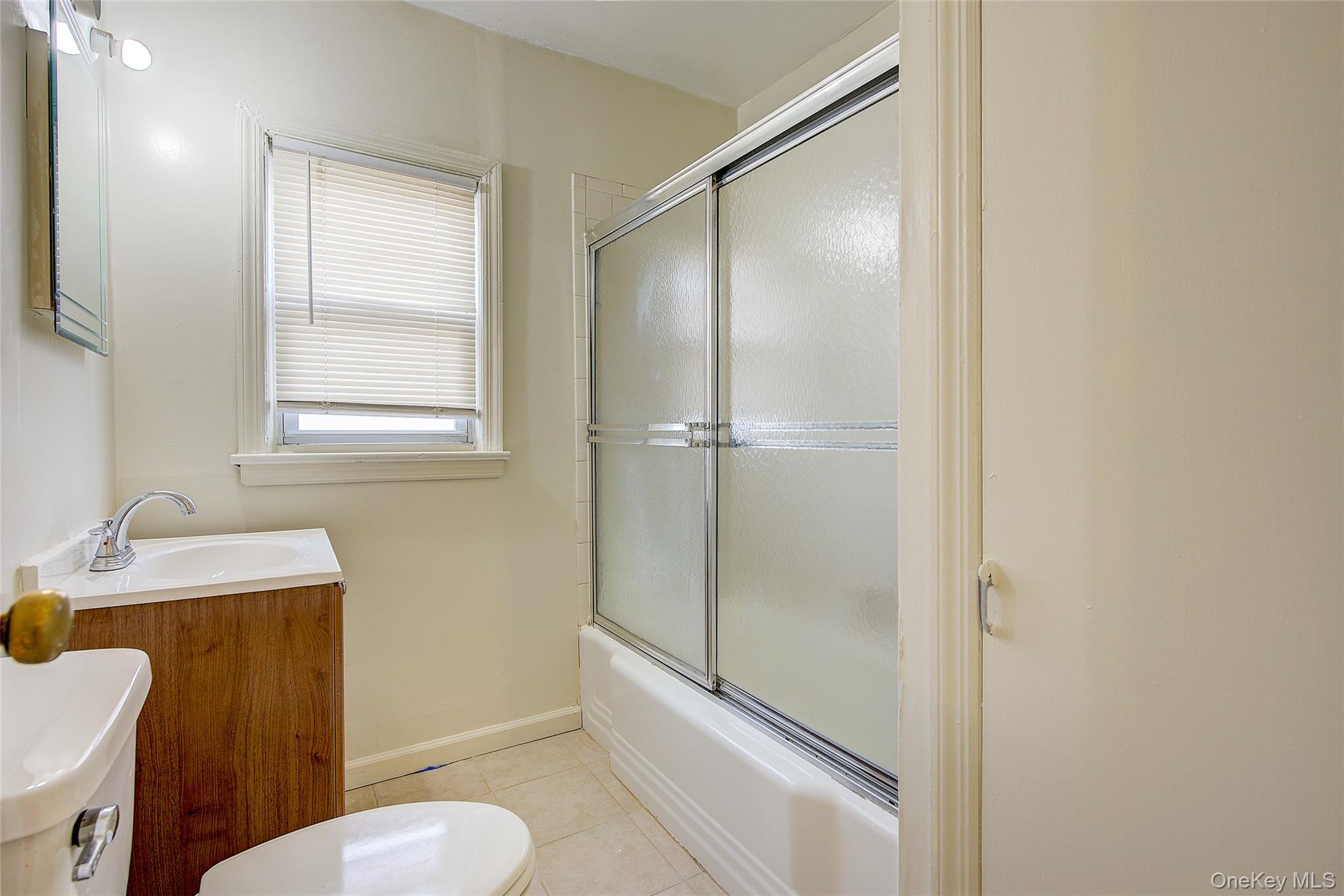220-04 103rd Avenue Queens, NY 11429 - Photo 21 of 35 a bathroom with a granite countertop sink toilet and shower