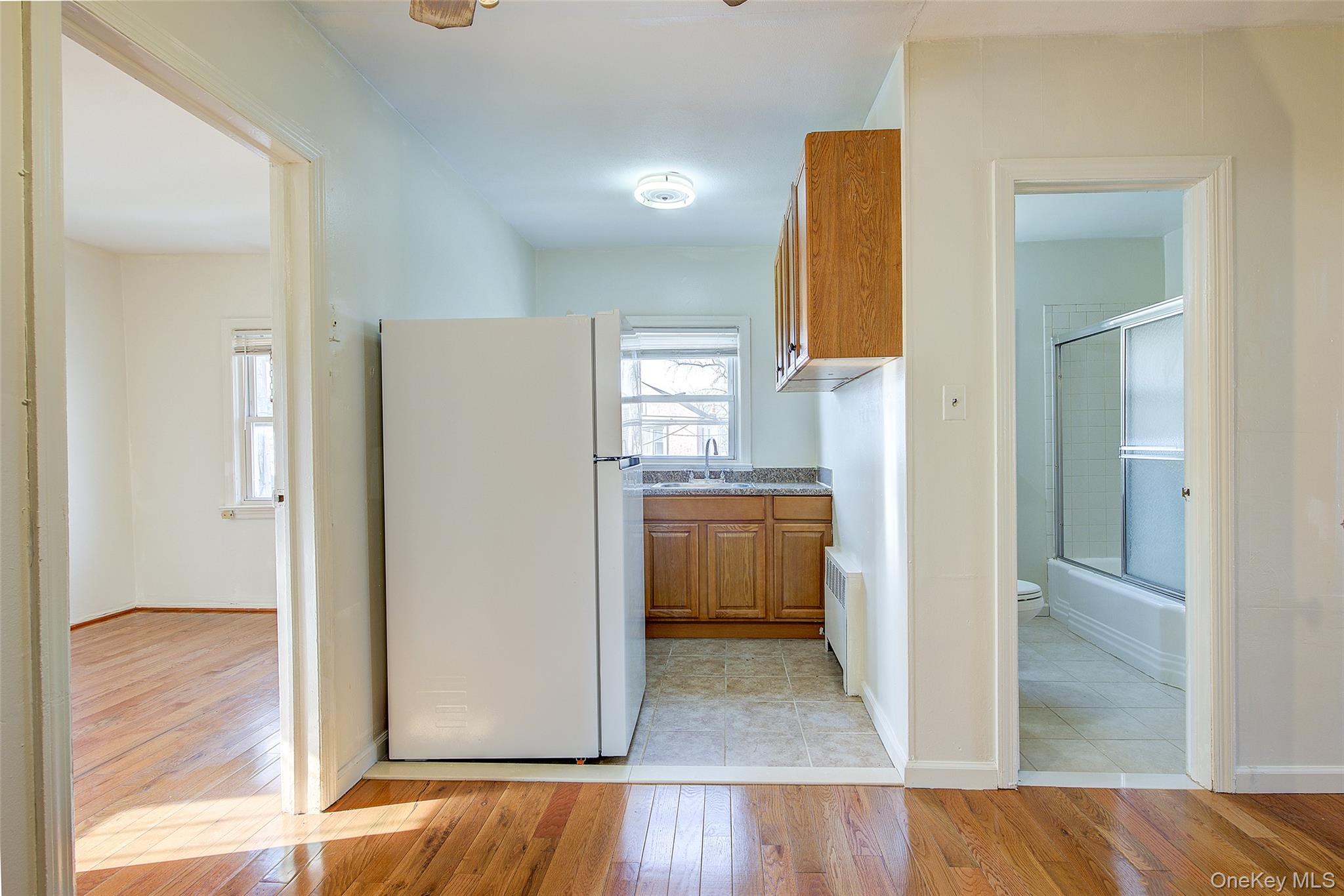220-04 103rd Avenue Queens, NY 11429 - Photo 23 of 35 a view of a bathroom with a tub and shower