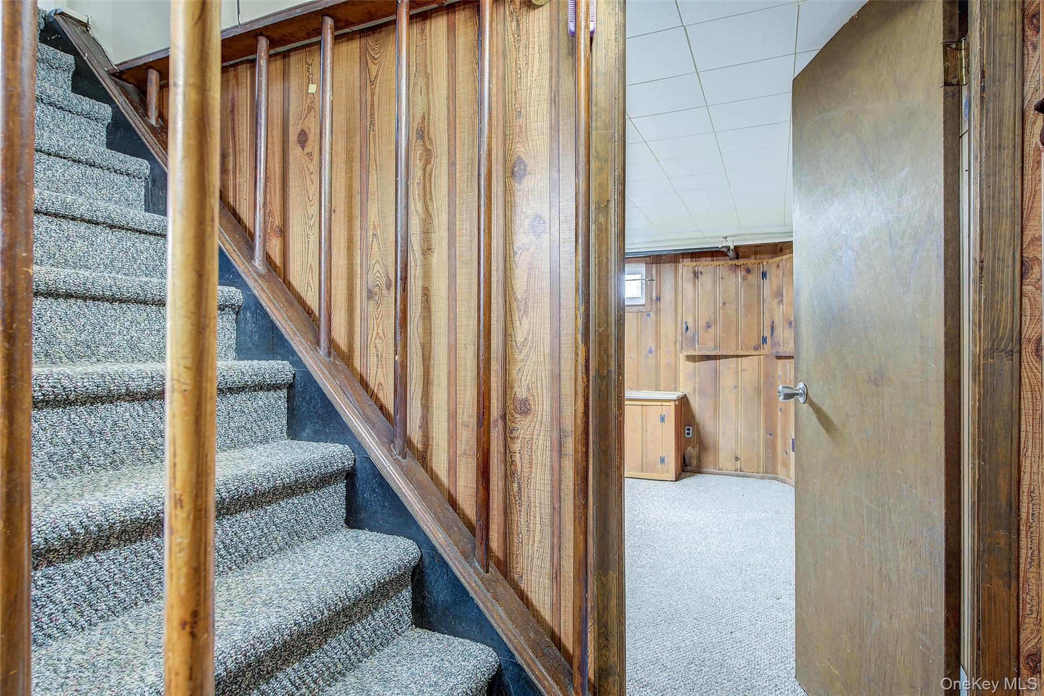 220-04 103rd Avenue Queens, NY 11429 - Photo 26 of 35 a view of a hallway with wooden floor and entryway