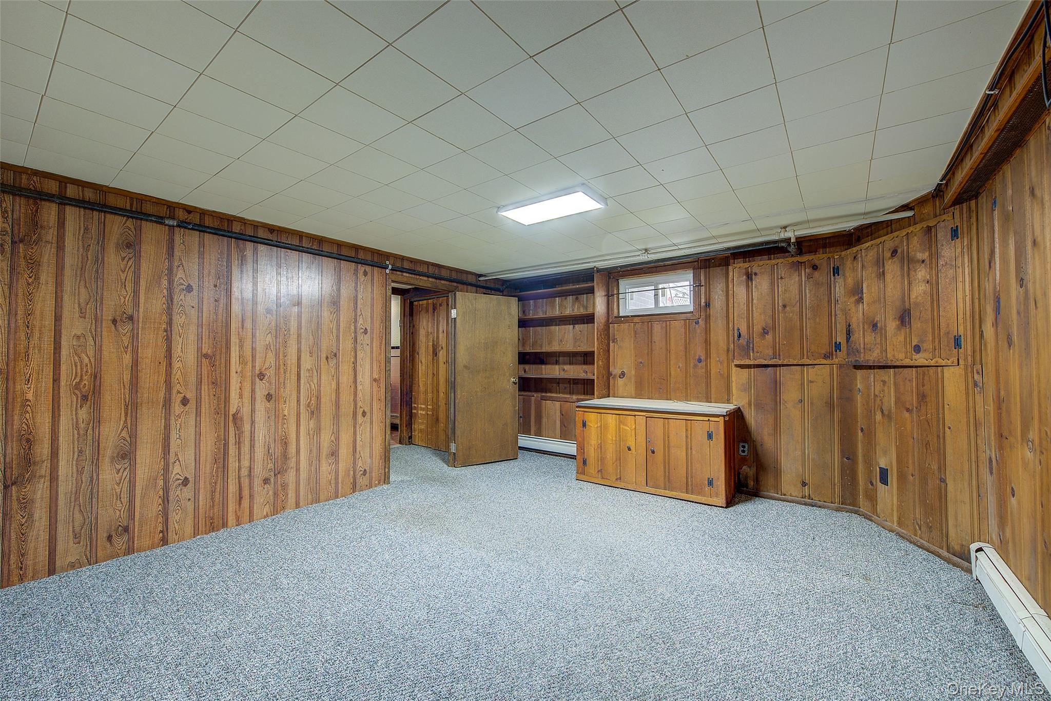 220-04 103rd Avenue Queens, NY 11429 - Photo 27 of 35 a view of an empty room with a window