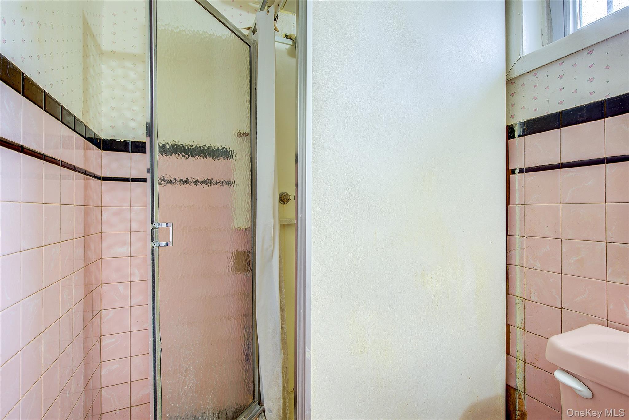 220-04 103rd Avenue Queens, NY 11429 - Photo 30 of 35 a bathroom with a shower and a sink