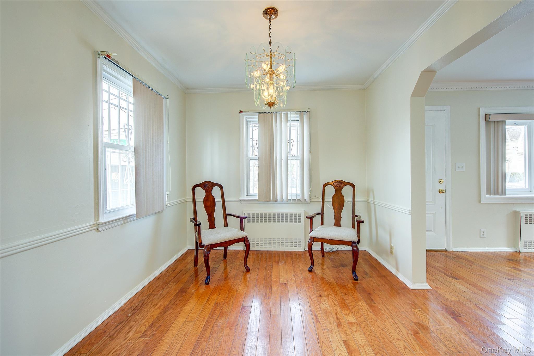 220-04 103rd Avenue Queens, NY 11429 - Photo 7 of 35 a view of a a dining room with furniture window and wooden floor