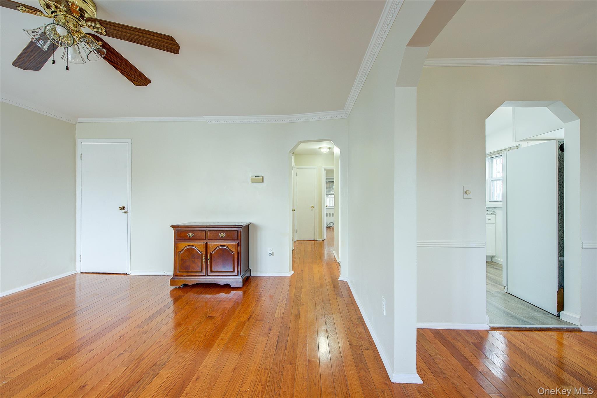 220-04 103rd Avenue Queens, NY 11429 - Photo 8 of 35 a view of a room with wooden floor and staircase