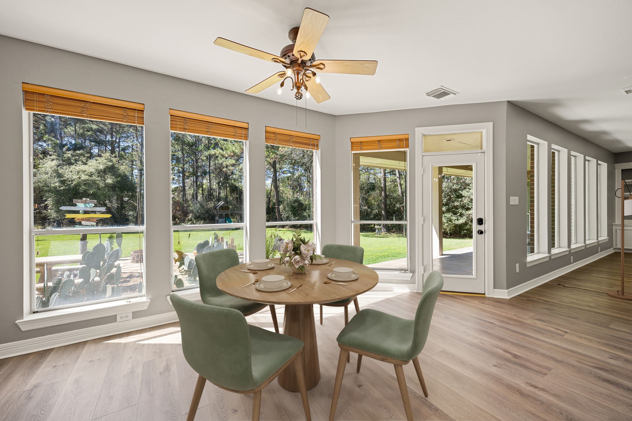 14419 Timbergreen Drive Magnolia, TX 77355 - Photo 10 of 43 Start your mornings in this bright breakfast area with walls of windows overlooking the backyard, creating a peaceful and relaxing place to enjoy every meal. *virtually staged*