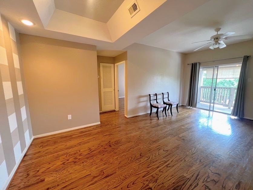 4041 Drake Street, Unit 118 Houston, TX 77005 - Photo 8 of 22 a view of dining room with furniture and wooden floor