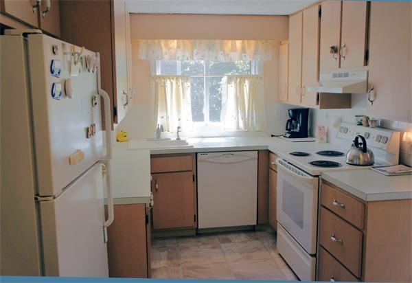 19 Edith Road Weymouth, MA 02189 - Photo 4 of 19 a kitchen with a sink stove and refrigerator