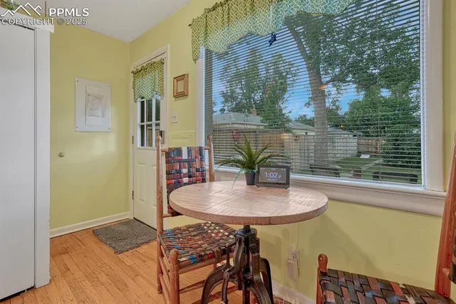 a dining room with furniture and window