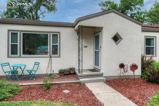 a front view of a house with garden