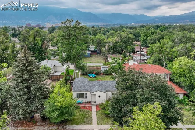 an aerial view of house with yard