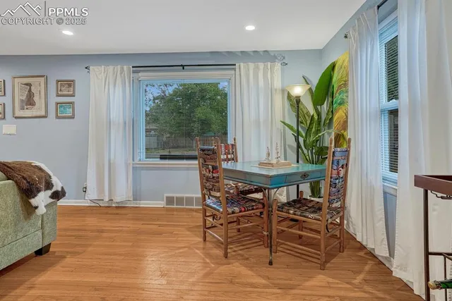a workspace with furniture and a potted plant