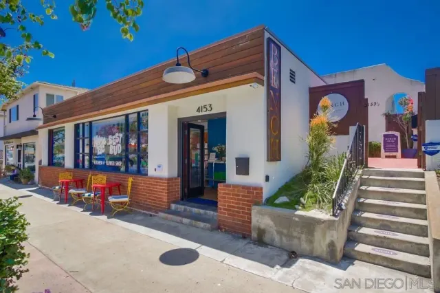 a front view of a house with large windows