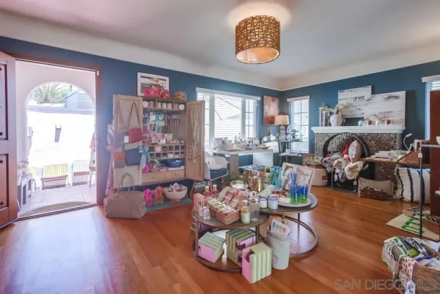 a living room with lots of furniture and air hockey table