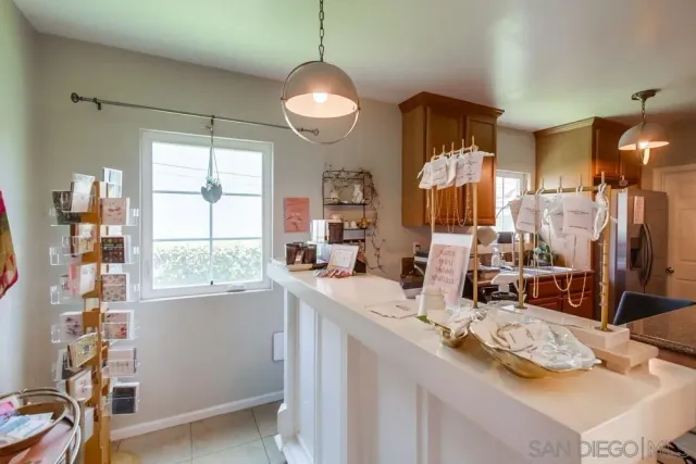 a kitchen with a cabinets appliances and furniture