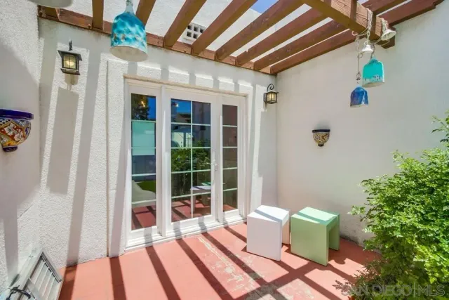 a view of a balcony with wooden fence