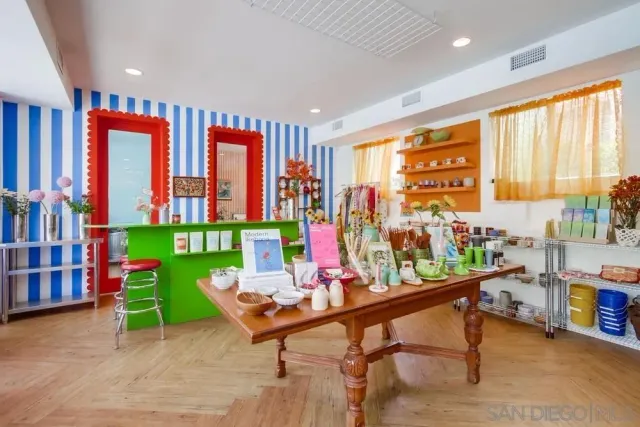 a dining room with furniture and a window