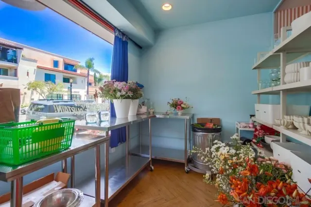 a living room filled with furniture and a chandelier