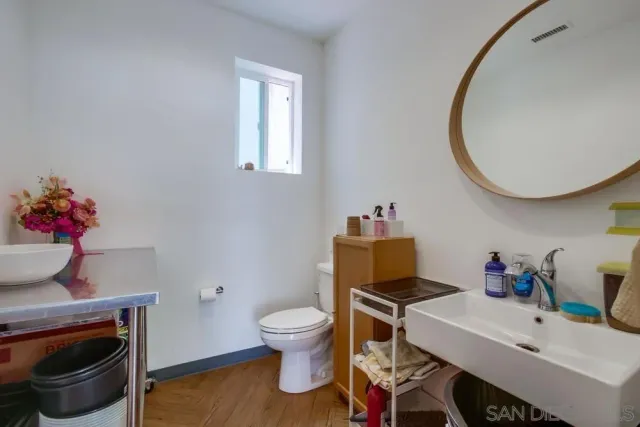 a living room filled with furniture and a potted plant