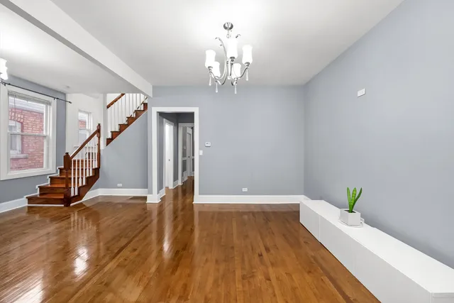 a open kitchen with stainless steel appliances granite countertop a stove refrigerator and a sink with granite countertops