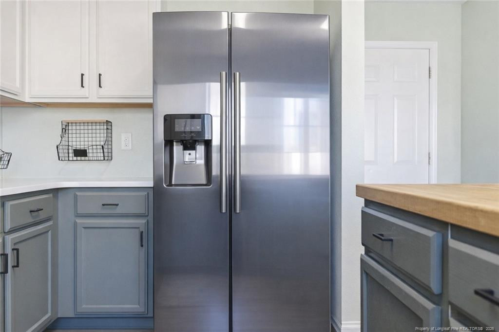 334 Crane Way Bunnlevel, NC 28323 - Photo 15 of 45 a kitchen with cabinets and stainless steel appliances