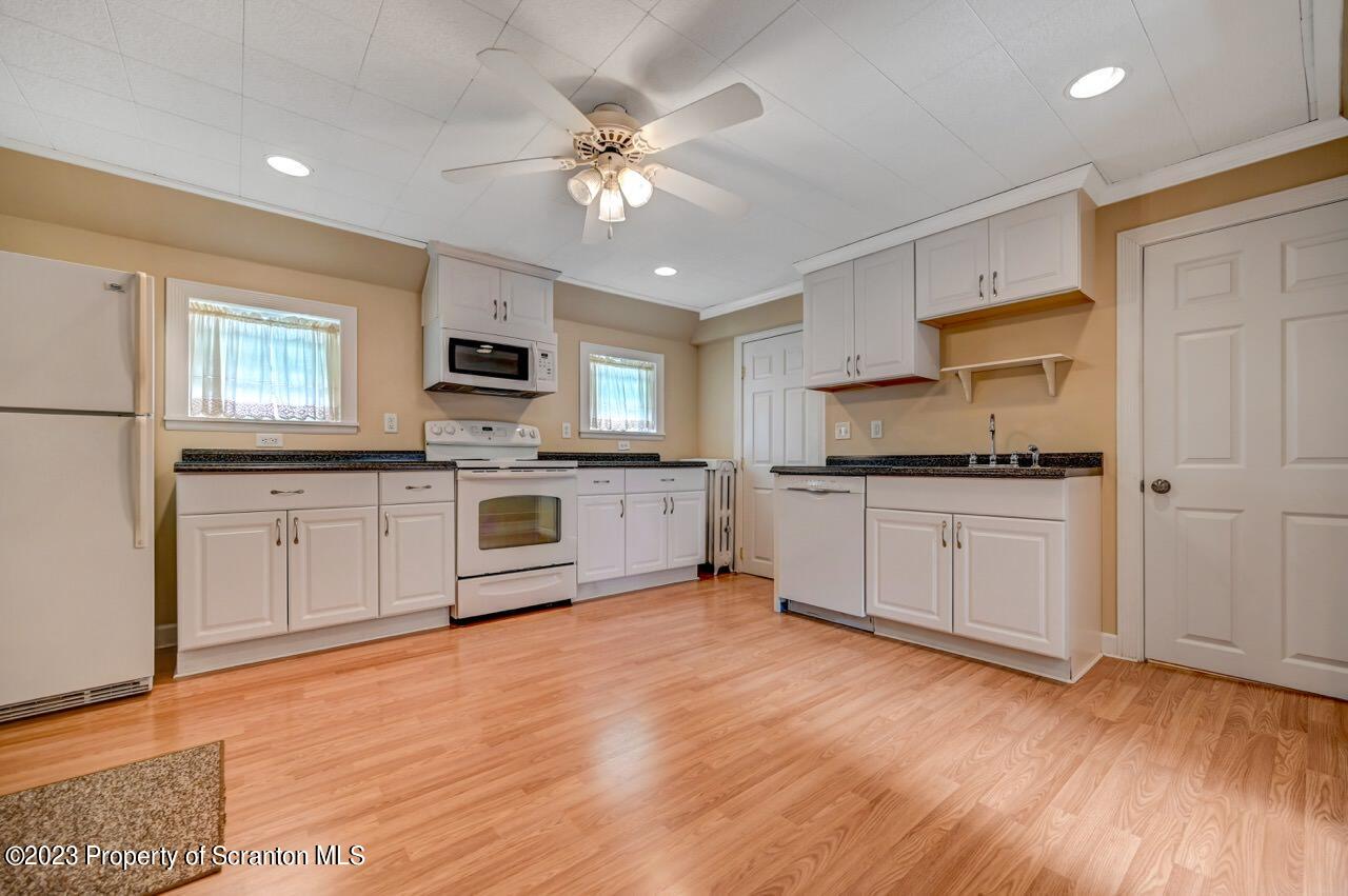 2035 Rigg Street Dunmore, PA 18512 - Photo 54 of 84 a kitchen with a white cabinets and window