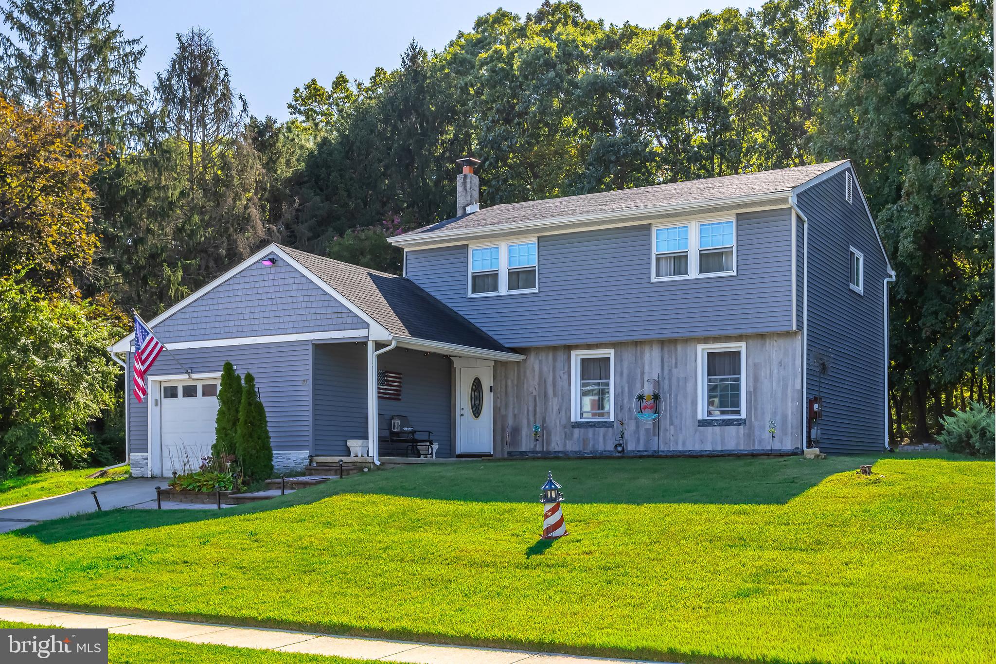 10 Loretta Boulevard Sicklerville, NJ 08081 - Photo 1 of 22 a view of a brick house with a yard and large trees