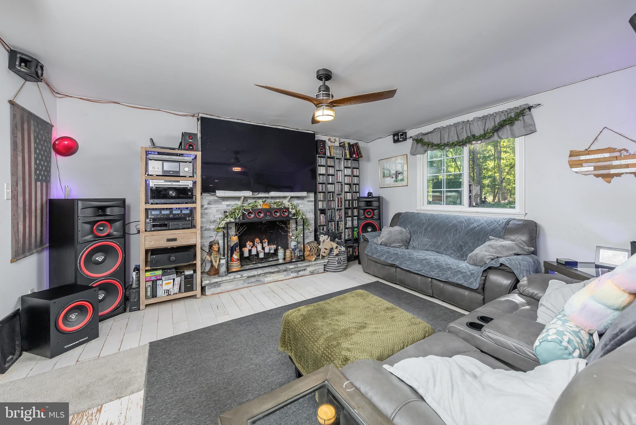 10 Loretta Boulevard Sicklerville, NJ 08081 - Photo 11 of 22 a living room with furniture a flat screen tv and a fireplace