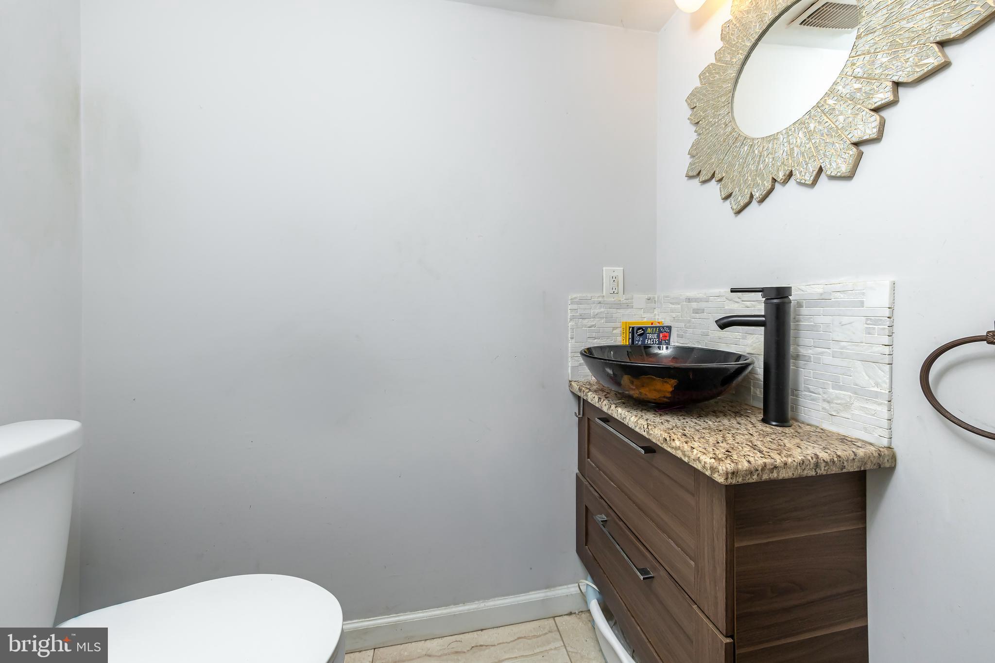 10 Loretta Boulevard Sicklerville, NJ 08081 - Photo 12 of 22 a bathroom with a granite countertop toilet sink and mirror