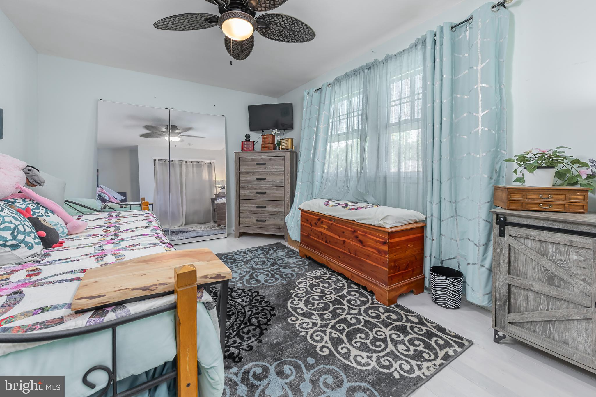 10 Loretta Boulevard Sicklerville, NJ 08081 - Photo 15 of 22 a bedroom with a bed and a chandelier