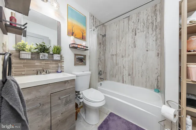 a bathroom with a sink a toilet and a bathtub