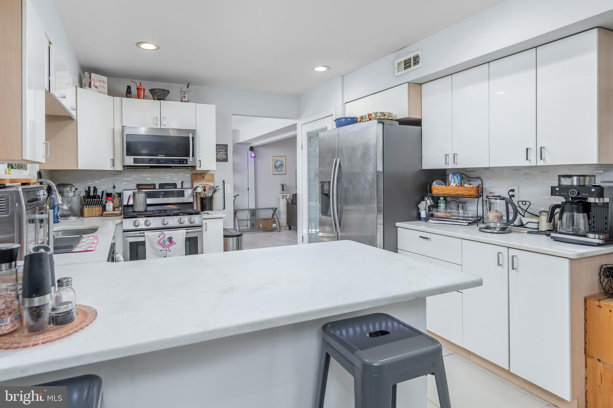 10 Loretta Boulevard Sicklerville, NJ 08081 - Photo 5 of 22 a kitchen with refrigerator and cabinets