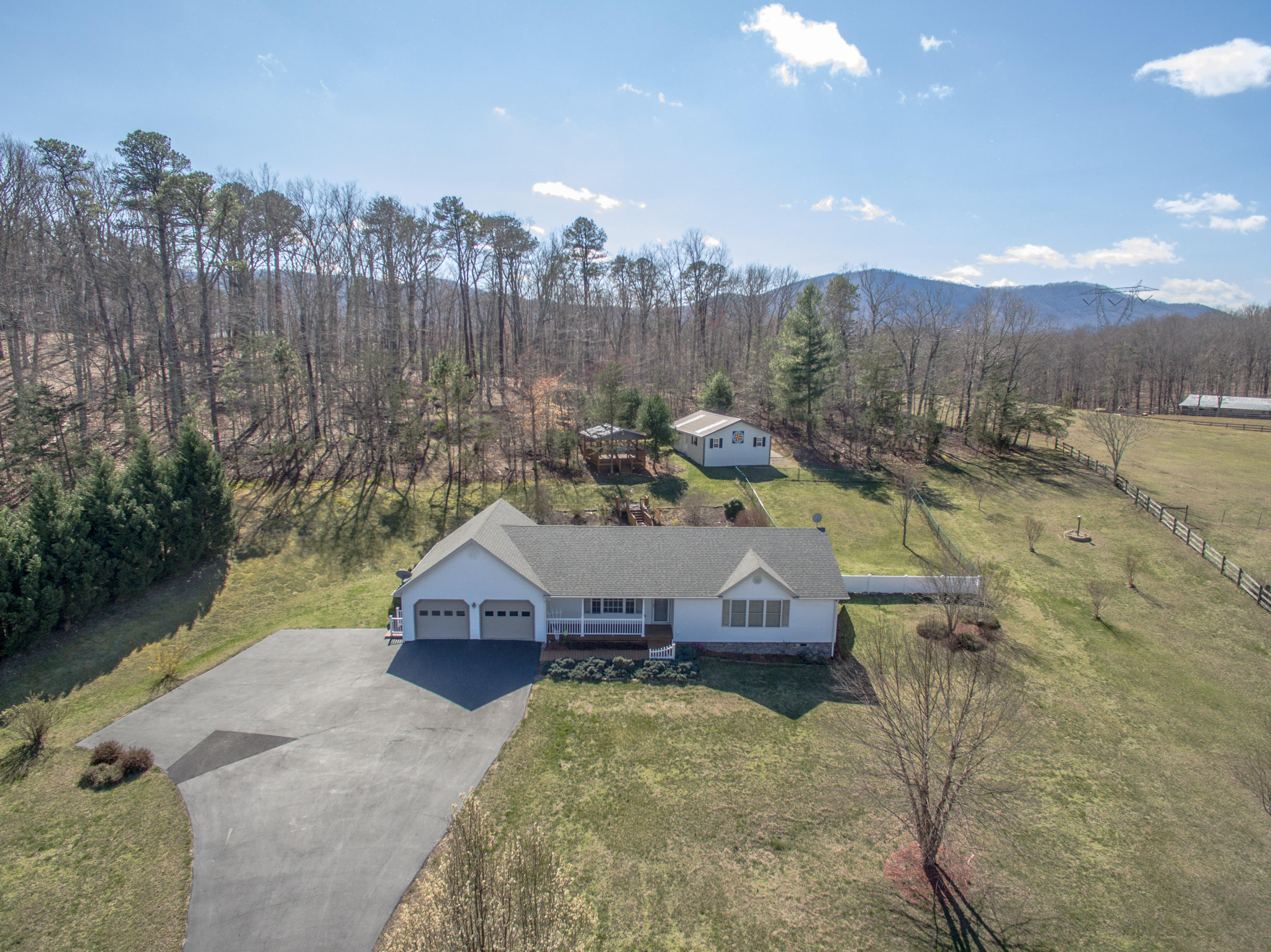 1546 Pike Road Montvale, VA 24122 - Photo 1 of 44 a view of a house with a yard and a wooden fence