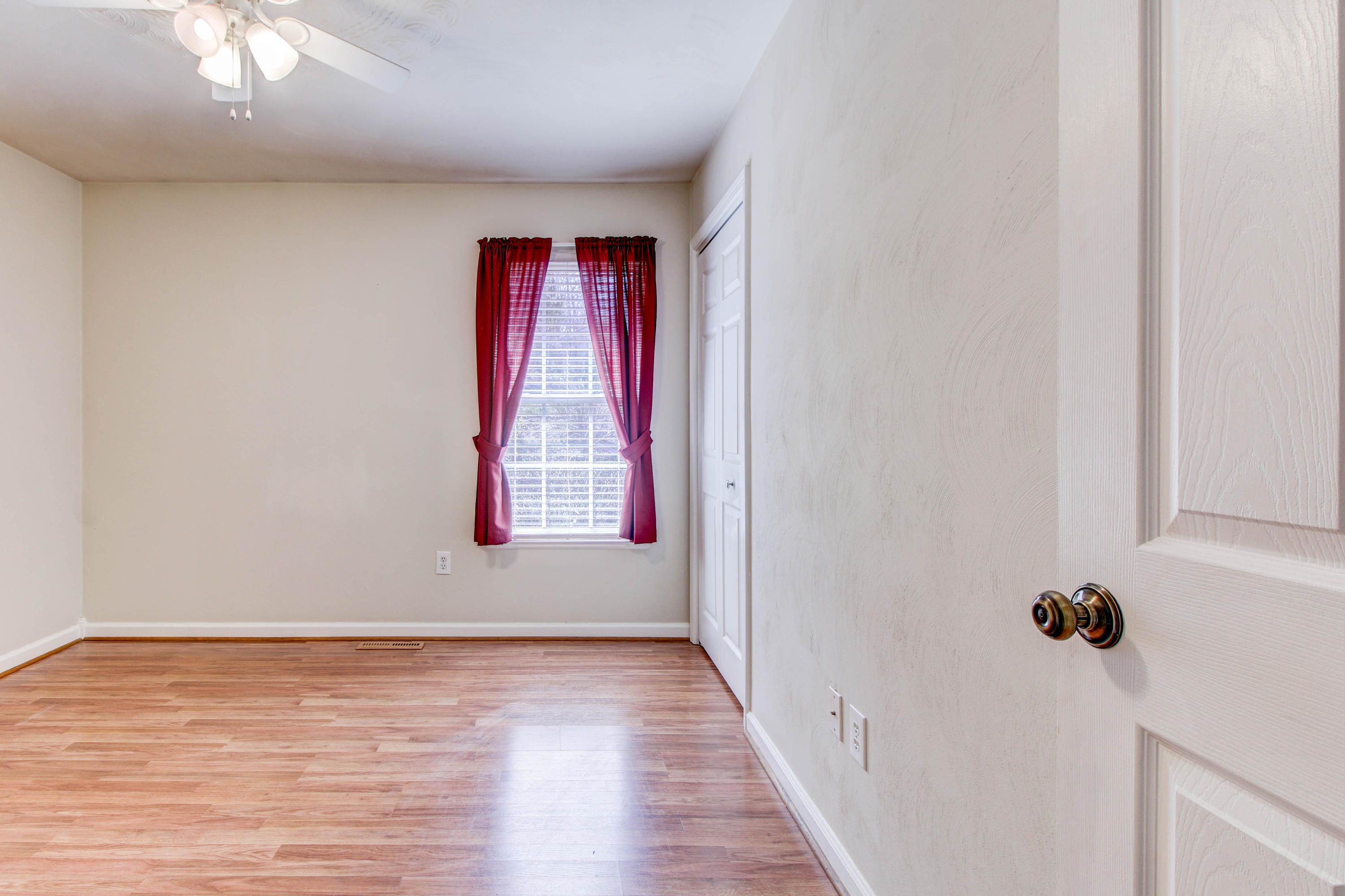 1546 Pike Road Montvale, VA 24122 - Photo 18 of 44 a view of an empty room with wooden floor and a window