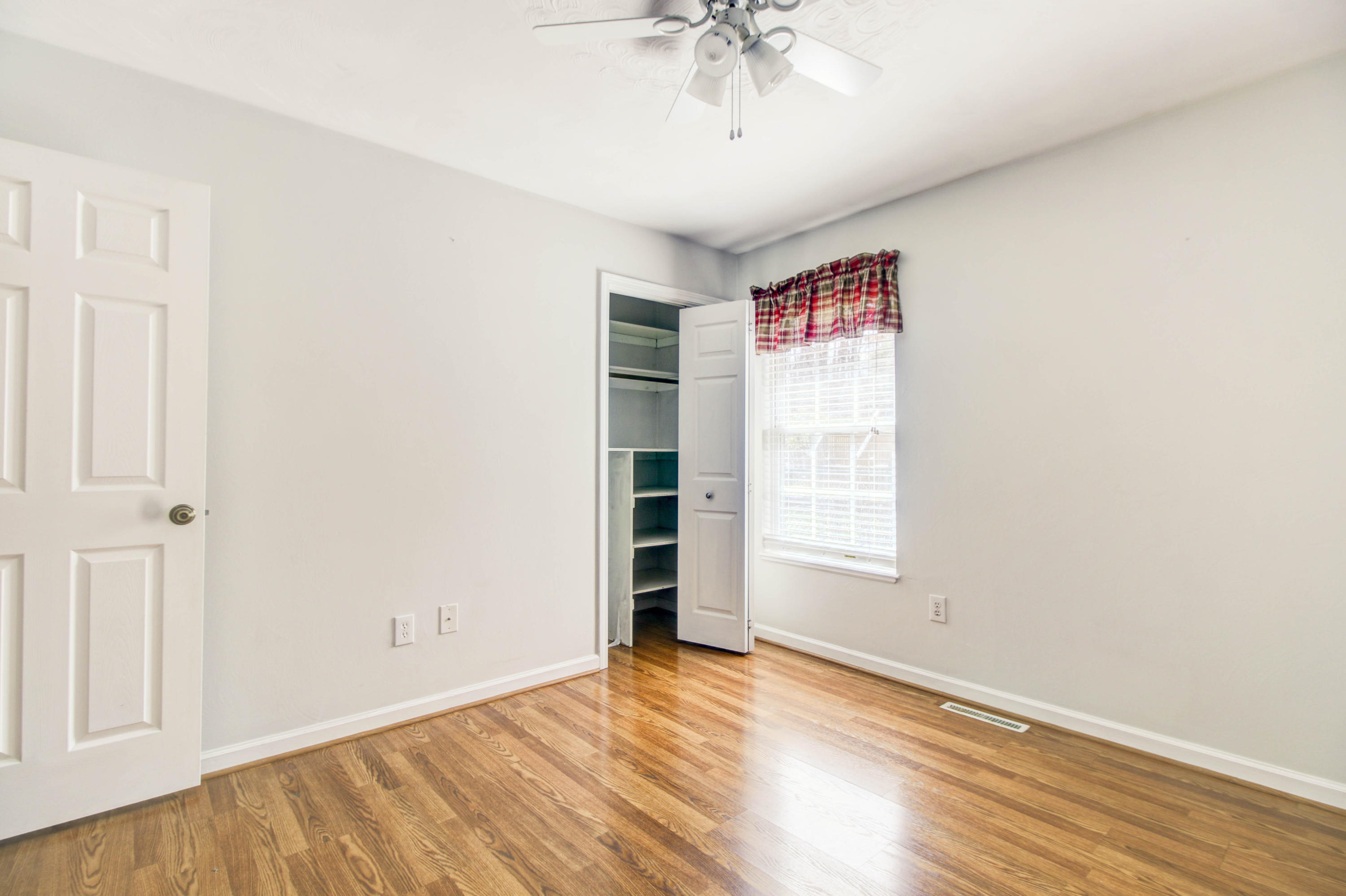 1546 Pike Road Montvale, VA 24122 - Photo 21 of 44 an empty room with wooden floor and windows