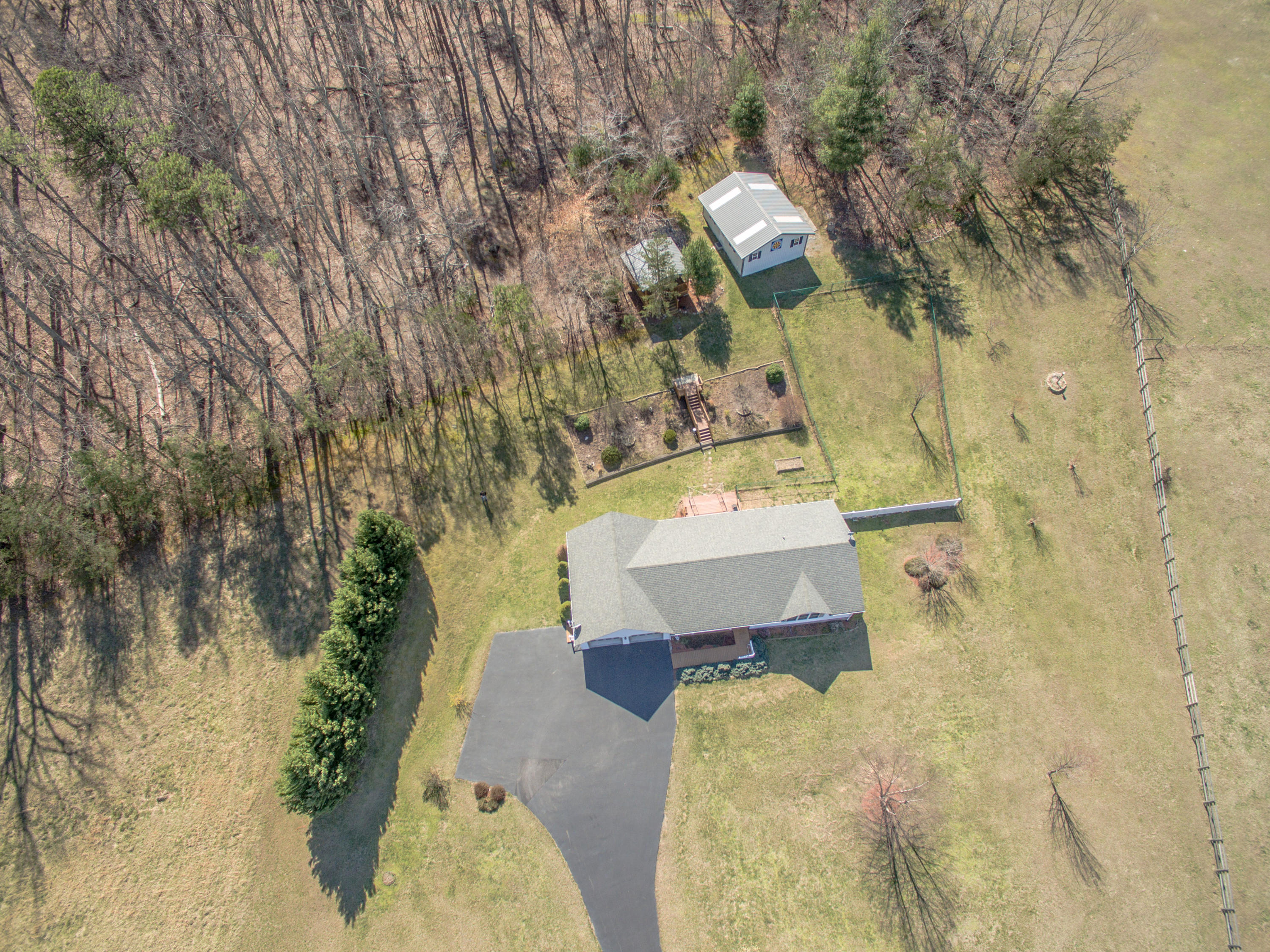1546 Pike Road Montvale, VA 24122 - Photo 43 of 44 a aerial view of a house with a yard and large trees