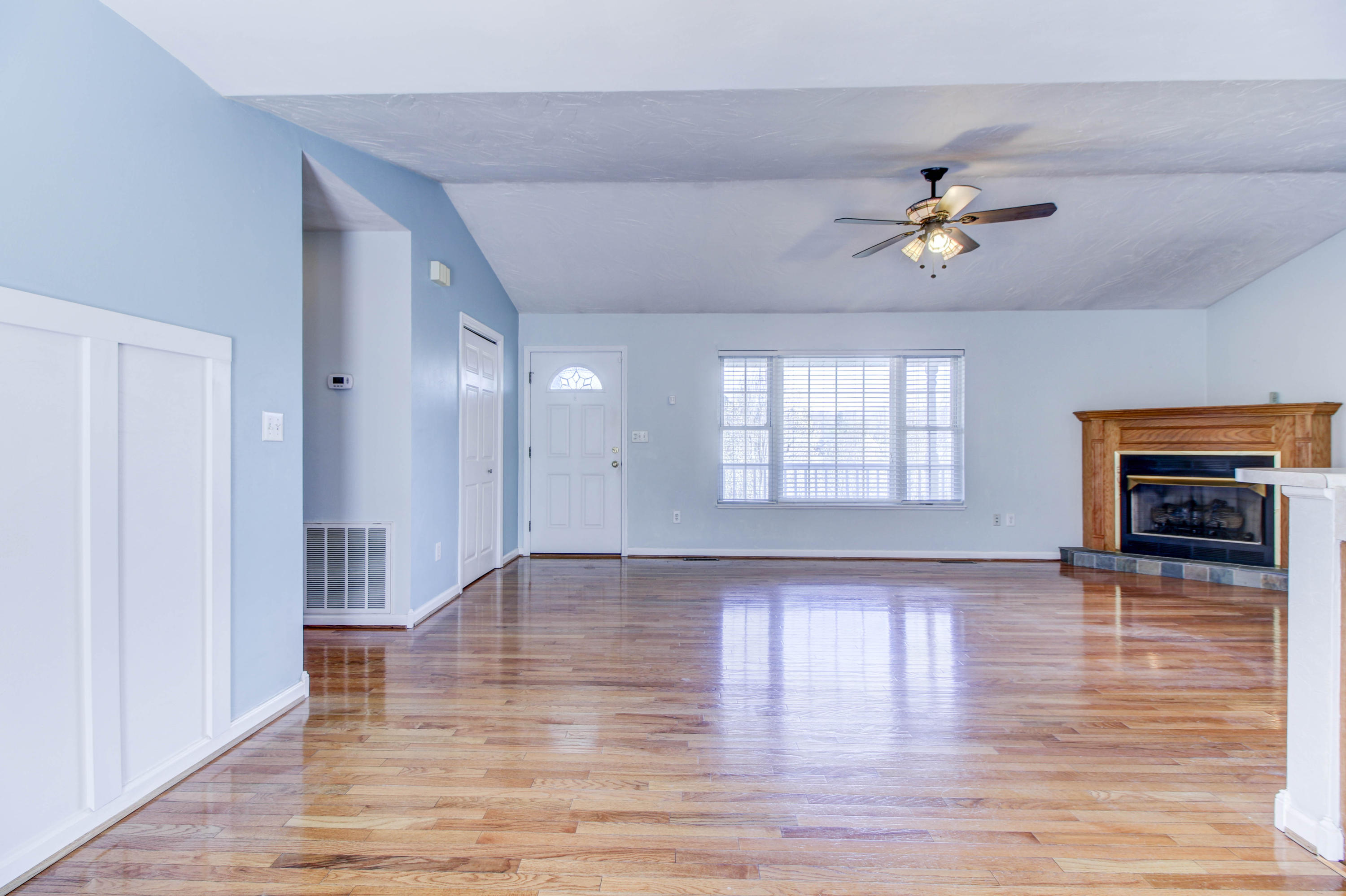 1546 Pike Road Montvale, VA 24122 - Photo 9 of 44 a view of empty room with wooden floor and fireplace