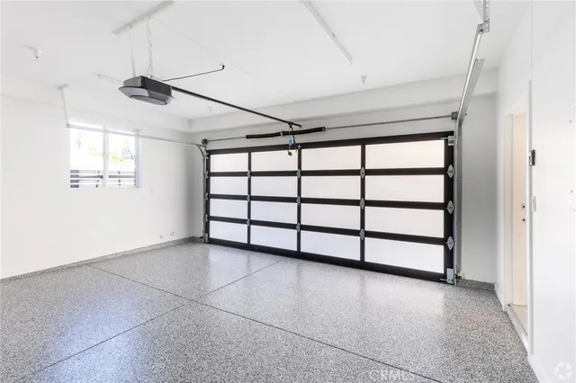 a view of a livingroom with a projector and furniture