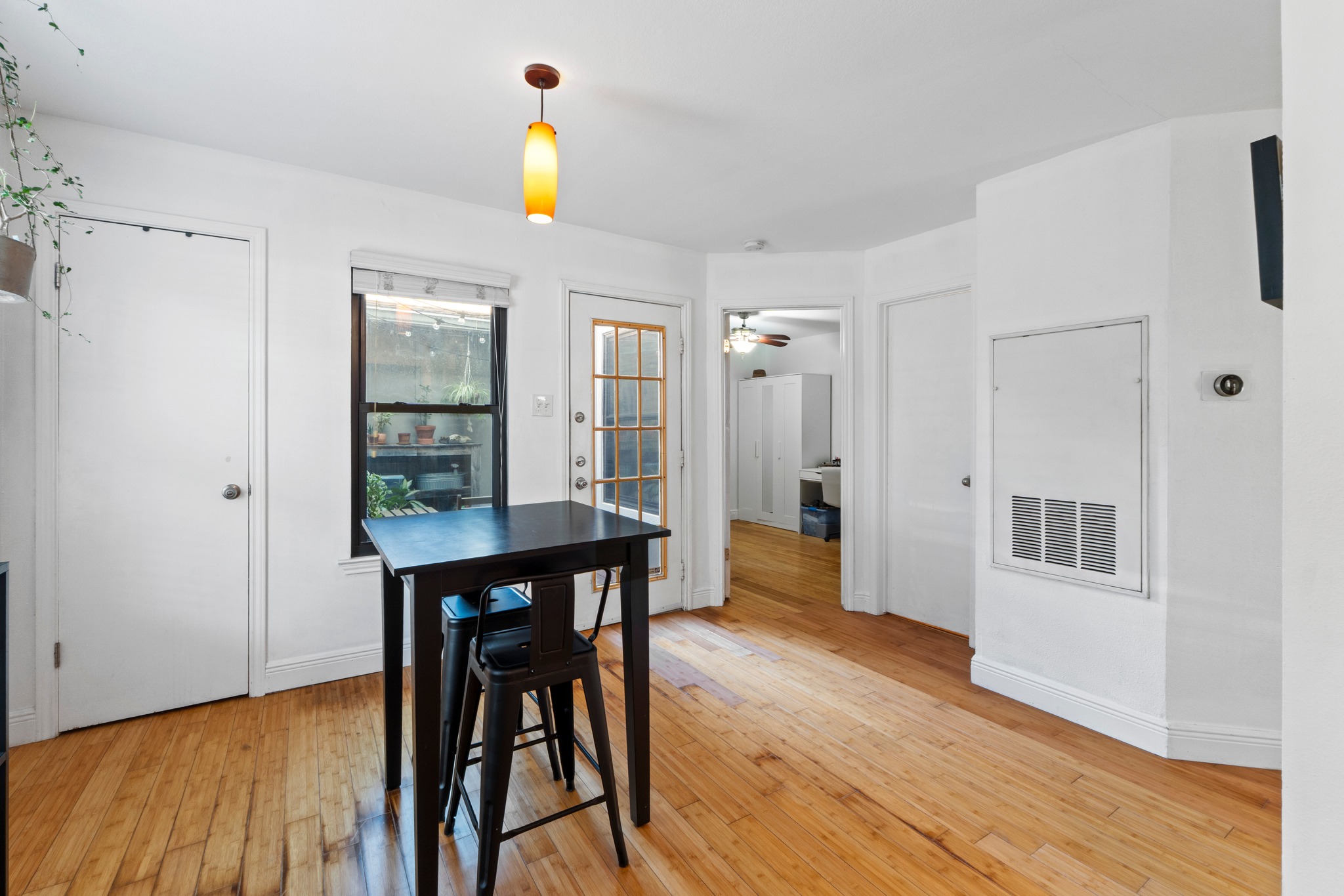 1750 Timber Ridge Road, Unit 102 Austin, TX 78741 - Photo 14 of 24 a view of a dining room with furniture window and wooden floor