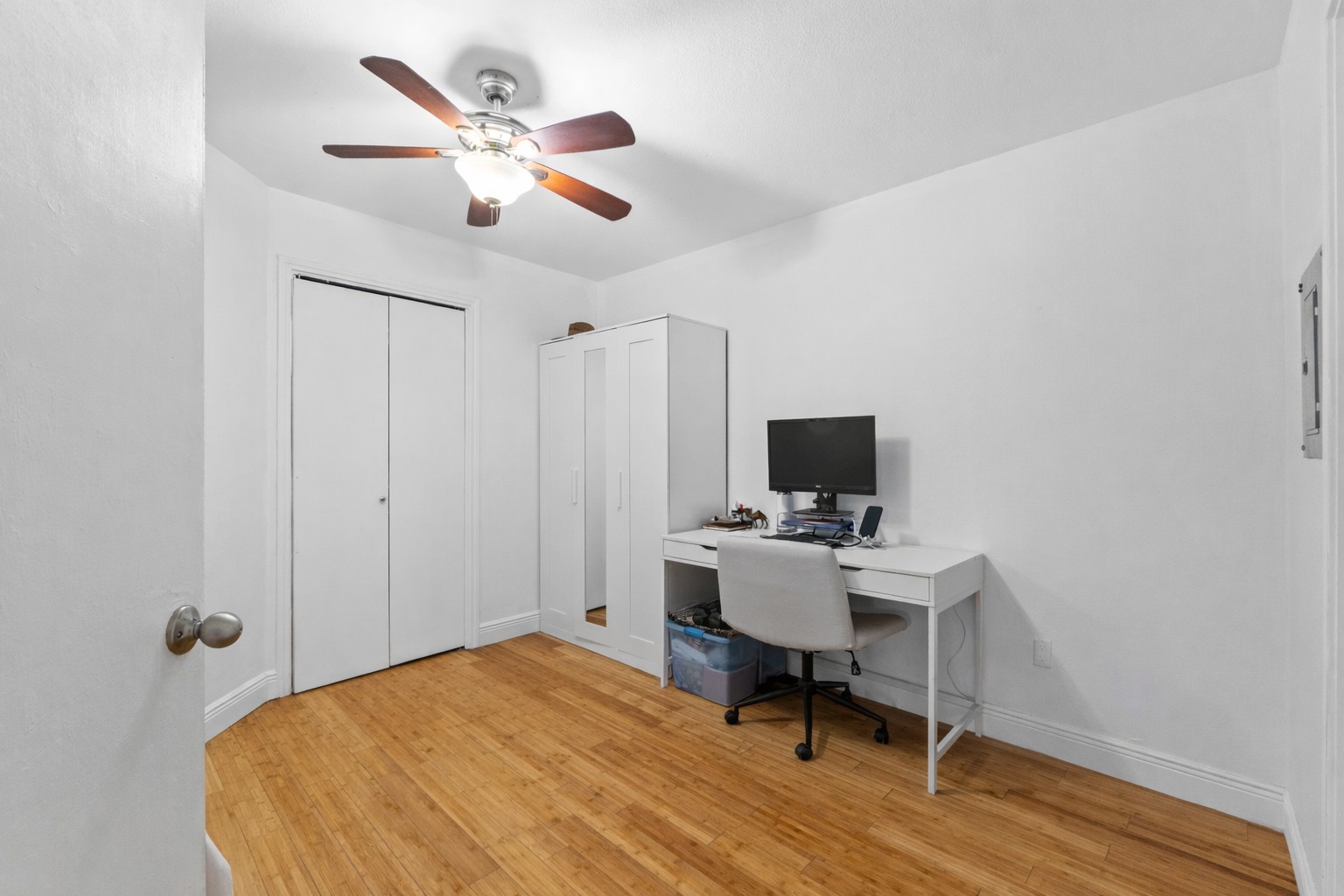 1750 Timber Ridge Road, Unit 102 Austin, TX 78741 - Photo 15 of 24 a workspace with furniture and wooden floor