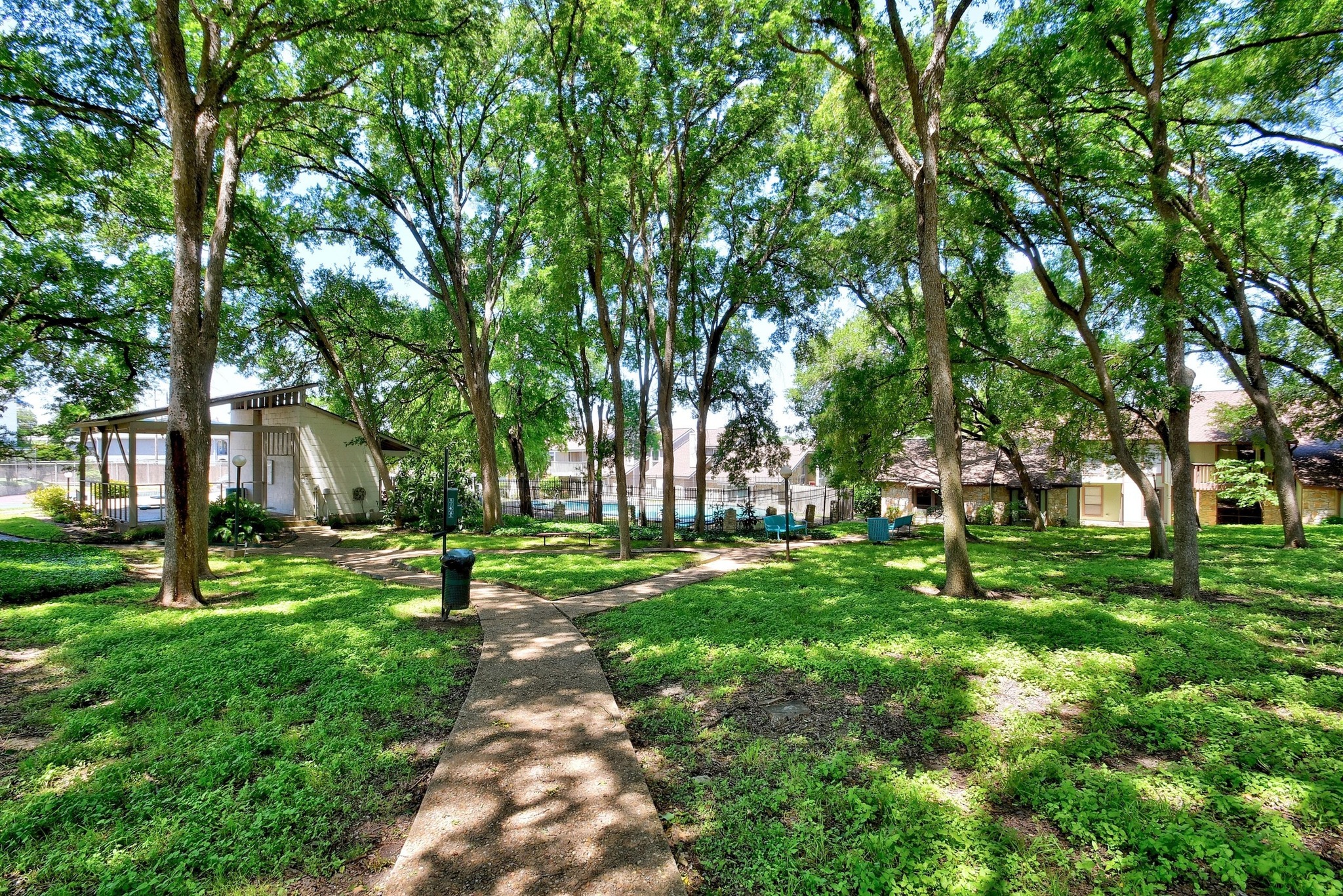 1750 Timber Ridge Road, Unit 102 Austin, TX 78741 - Photo 20 of 24 a view of a park with large trees